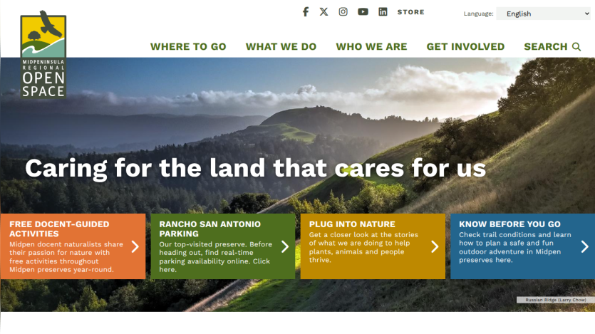Website header with navigation and hero section showing mountains and text about caring for the land