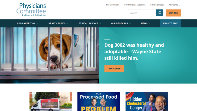 Homepage of Physicians Committee with a dog in a cage and a headline about animal welfare.