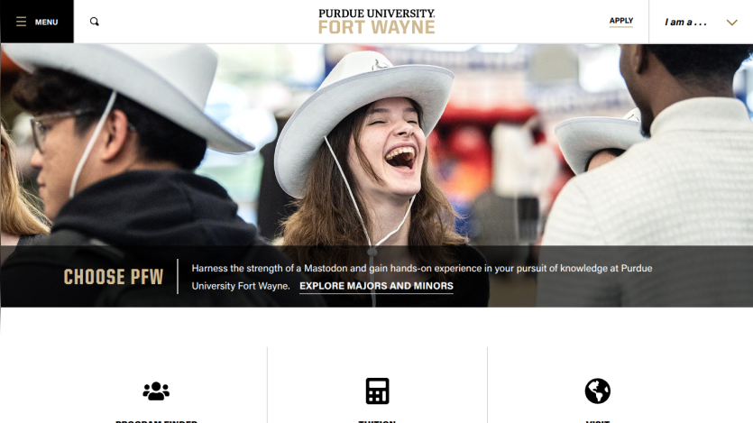 Purdue University Fort Wayne website hero section with smiling students and navigation menu
