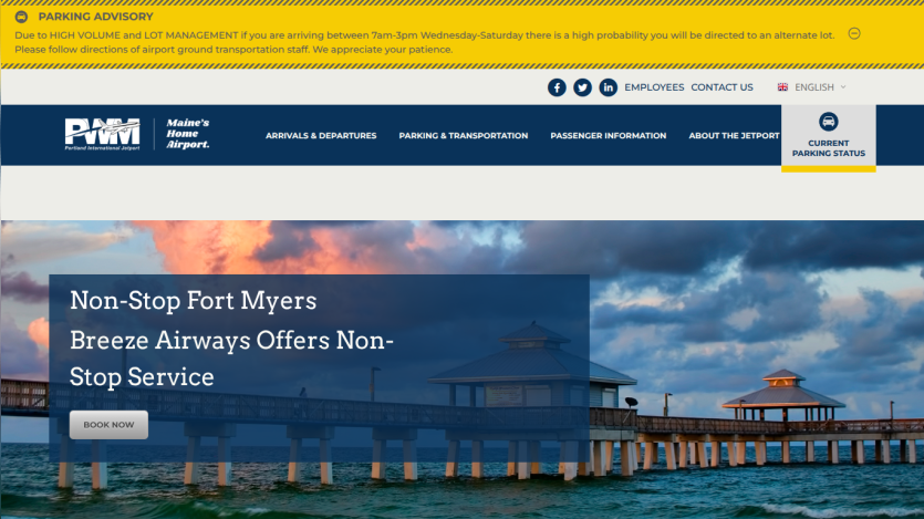 Portland International Jetport homepage with parking advisory and Breeze Airways non-stop service to Fort Myers