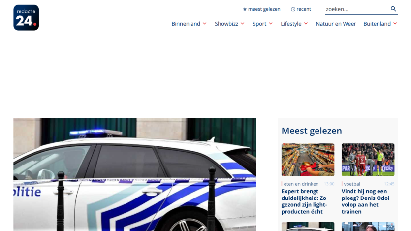 News website featuring a police car image and links to popular articles.