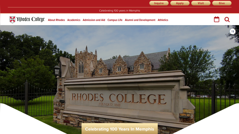 Rhodes College entrance sign with campus buildings in the background.