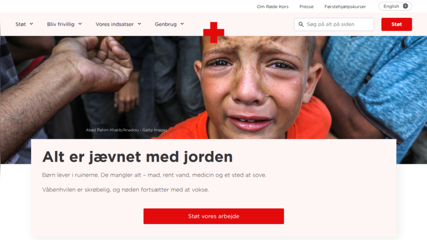 Red Cross website hero with a crying child and text about children living in ruins needing food, water, medicine, and shelter