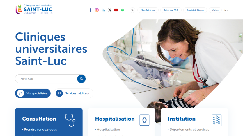 Homepage of Cliniques universitaires Saint-Luc with search bar, consultation, hospitalization, and institution options, and image of doctor with baby