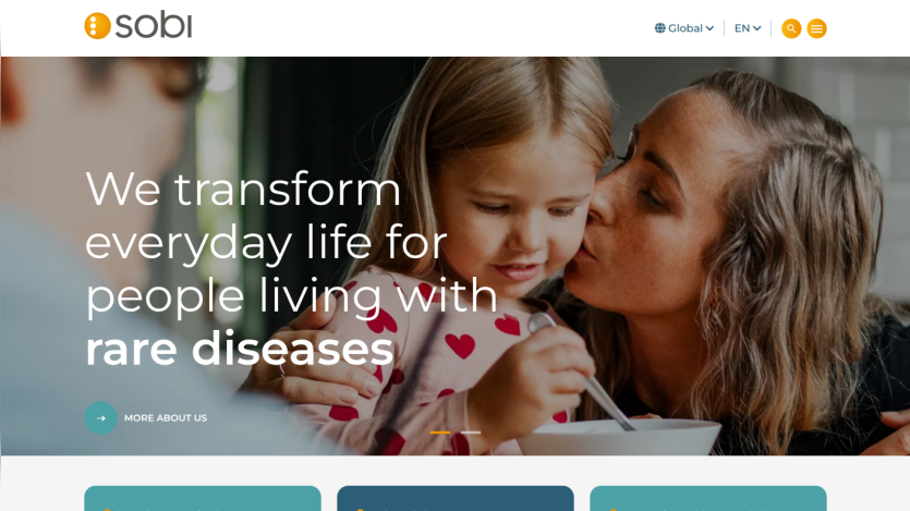 Homepage hero section with text about transforming life for people with rare diseases and a woman kissing a child