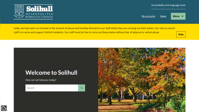 Solihull Metropolitan Borough Council homepage with search bar and autumn park image