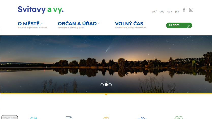 Svitavy city website with navigation for city info, citizen services, leisure, and a night lake hero image