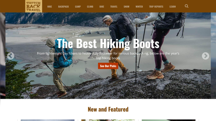 Homepage featuring hiking boots with a scenic background and call-to-action button.