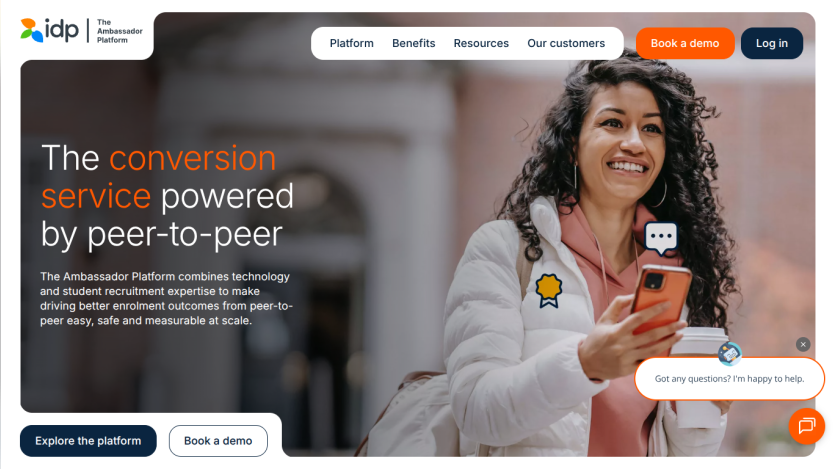 Homepage of The Ambassador Platform showing a smiling woman holding a phone and coffee, with text about peer-to-peer conversion service