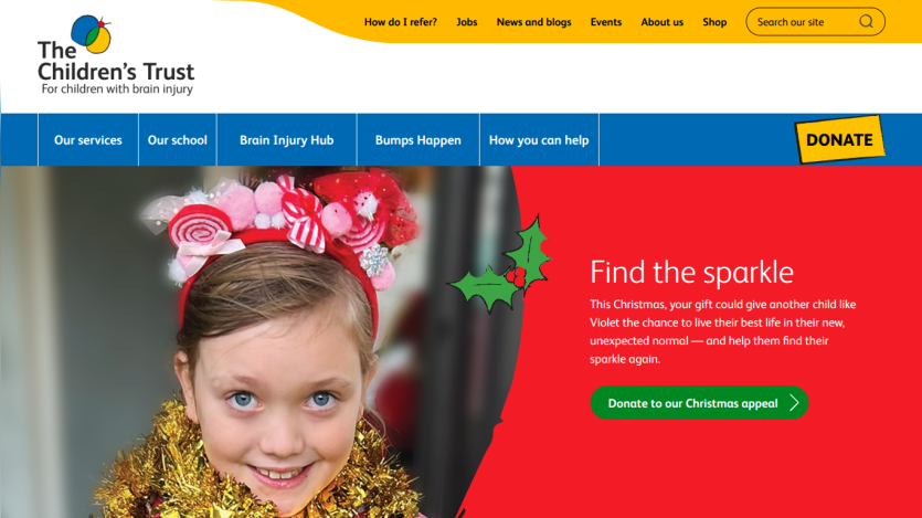 The Children's Trust homepage with navigation and a Christmas appeal featuring a smiling child in festive attire and a donate button
