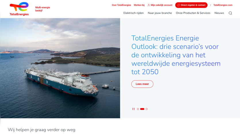 TotalEnergies website with energy outlook headline and image of a large ship in a harbor with wind turbines in the background