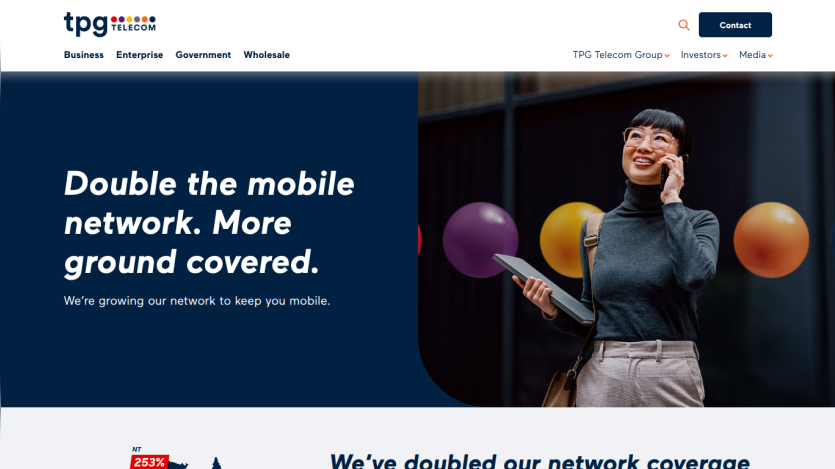 Promotional message about expanding mobile network coverage with a smiling woman holding a tablet.