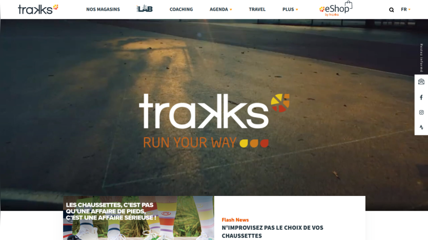 Traxks running app homepage with slogan 'Run Your Way' and navigation menu