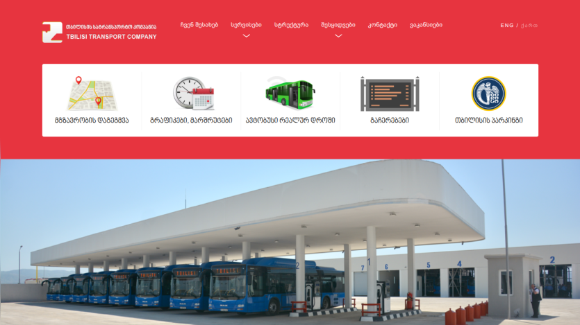 Tbilisi Transport Company website with navigation icons and hero image of blue buses at a depot