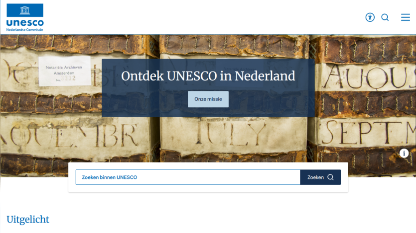 UNESCO Netherlands homepage with aerial landscape background, headline 'Ontdek UNESCO in Nederland', and search bar