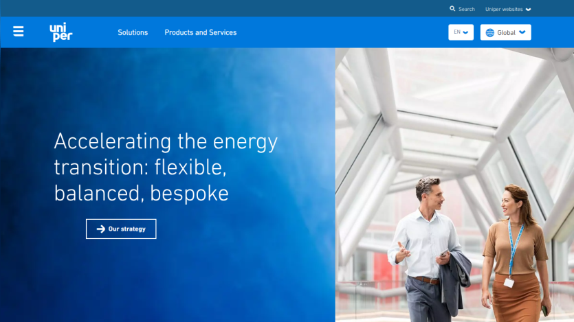 Homepage featuring a tagline about energy transition and two people walking in a modern setting.