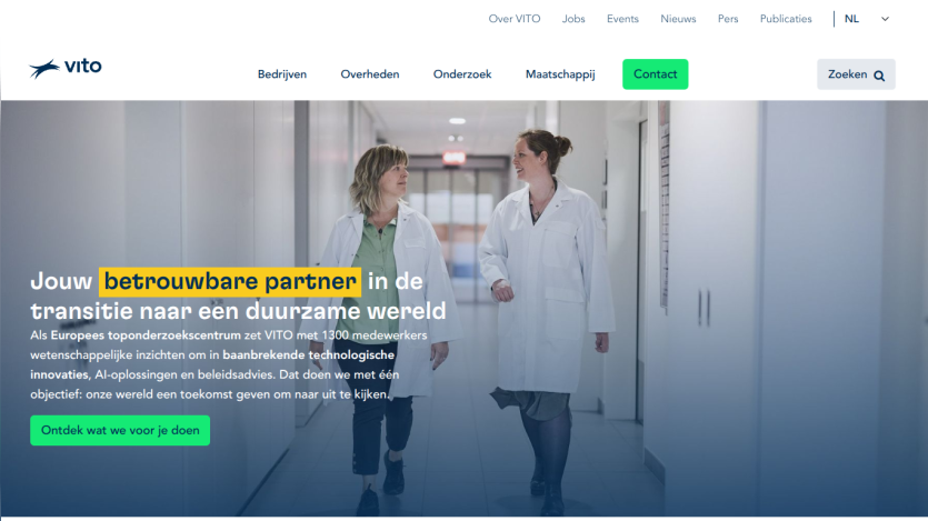 Two professionals in lab coats walking in a corridor, with a tagline about being a reliable partner for a sustainable world.