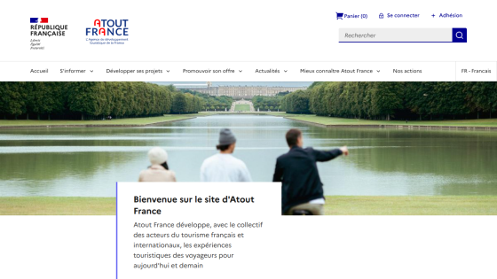 Welcome message for the About France website with scenic background and three people looking at a landscape.