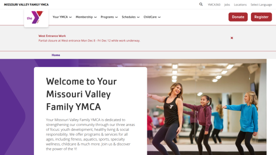 Homepage with navigation bar, large hero image showing a woman with a laptop, and headline about digital marketing