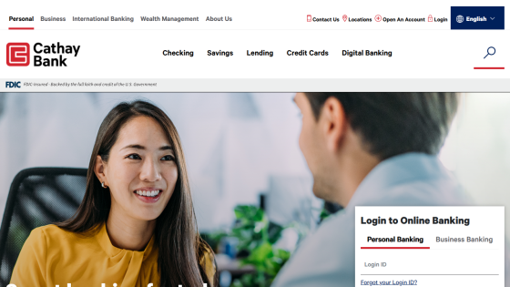 Cathay Bank homepage with navigation menu, hero image of two people talking, and online banking login form