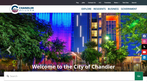 Homepage of Chandler city website with a welcome message and vibrant cityscape background.