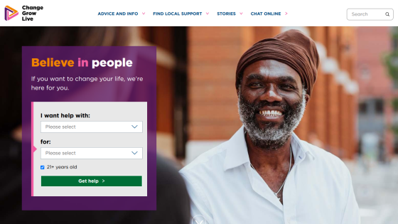 Change Grow Live homepage with navigation, search, and a help form alongside a smiling man outdoors.