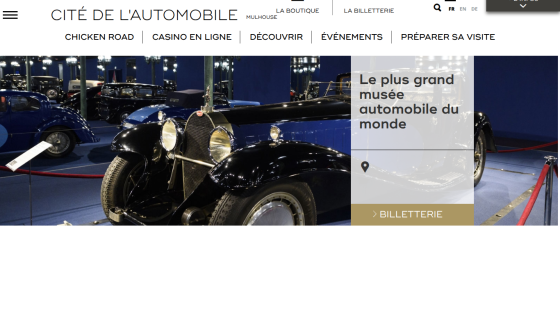 Homepage of Cité de l'Automobile museum with vintage cars and navigation menu in French