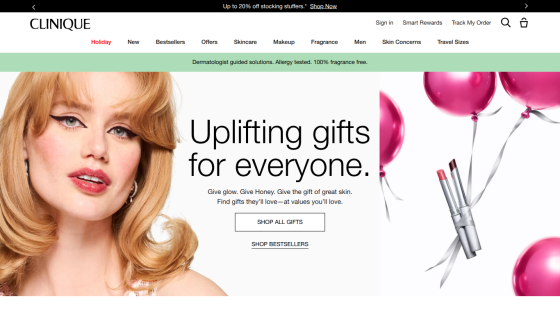 Clinique homepage featuring a smiling woman and promotion for uplifting gifts with pink balloons and a shop all gifts button