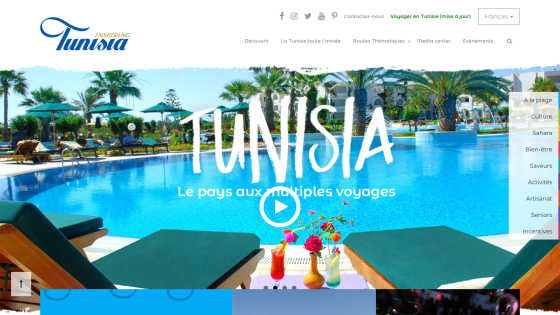 Tourism website featuring a sunny poolside scene with lounge chairs and drinks, promoting Tunisia travel
