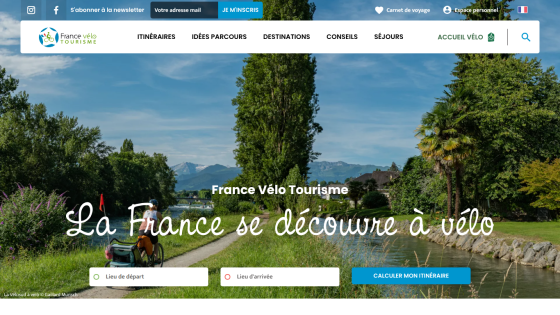 Homepage of France Vélo Tourisme promoting cycling in France with a scenic background.
