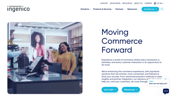Website showcasing commerce solutions with a woman at a checkout counter and a large image in the background.