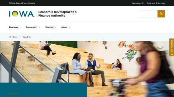 Iowa Economic Development & Finance Authority website with navigation and image of people working and talking in a modern space