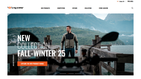 Homepage showcasing new Fall-Winter 25 collection with a man standing on a dock by a lake and mountains in the background