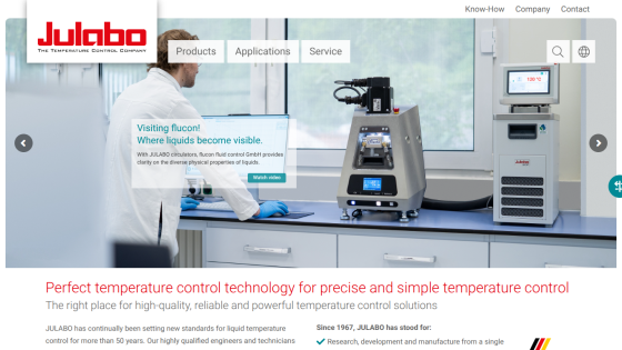 Julabo homepage showcasing temperature control technology with a scientist using equipment and product highlights