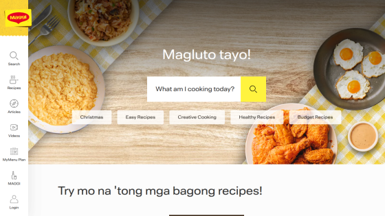 Cooking website homepage with search bar, recipe categories, and images of food dishes
