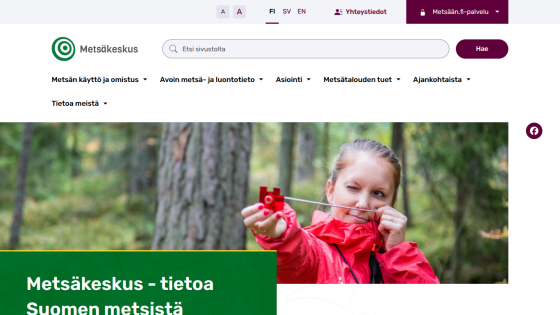 Metsäkeskus website with navigation menu, search bar, and hero image of a woman in a red jacket measuring in a forest