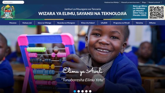 Educational website homepage with smiling children and text promoting education and technology in Swahili