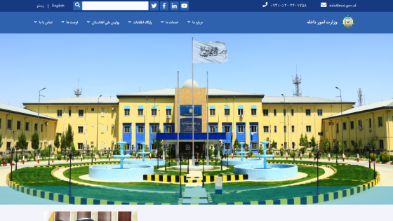 University campus building with a central fountain and blue sky, navigation bar with academic links above