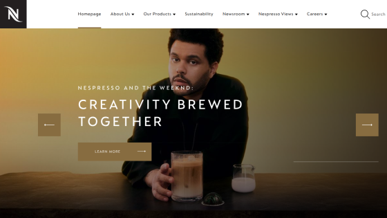 Nespresso homepage hero with headline Creativity Brewed Together and a man holding a glass of coffee