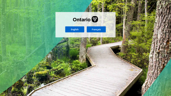 Ontario government login page with English and French language options over a forest boardwalk background