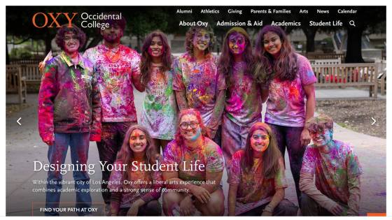Occidental College homepage featuring students celebrating with colorful powder, promoting student life.