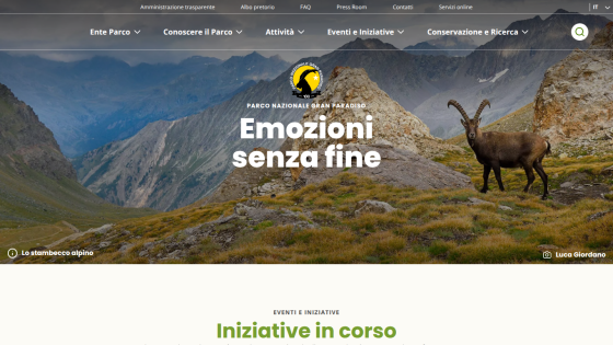 Parco Nazionale Gran Paradiso website hero with mountain landscape and alpine ibex, navigation menu visible
