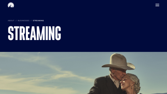 Streaming section with large text and a couple embracing against a scenic background.
