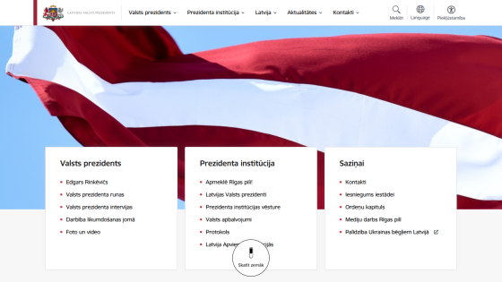 Latvian President's official website with navigation menus and sections on president, institution, and contacts over a Latvian flag background