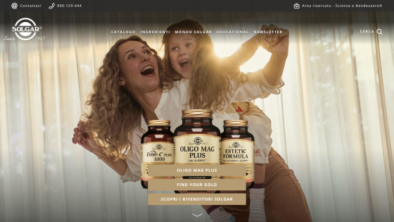 Solgar supplement bottles featured with a joyful mother and child in the background, navigation menu and contact info visible