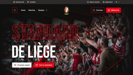 Standard de Liège football club homepage with crowd image, navigation menu, and match buttons