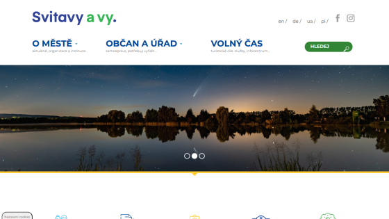 Svitavy city website with navigation for city info, citizen services, leisure, and a night lake hero image