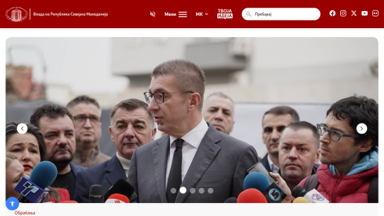 Government of North Macedonia website header with navigation and a hero image of a man speaking to media with microphones