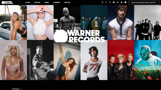 Warner Records homepage featuring various artists in a grid layout.