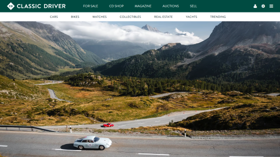 Classic Driver website showcasing a scenic mountain road with a red car and navigation options.